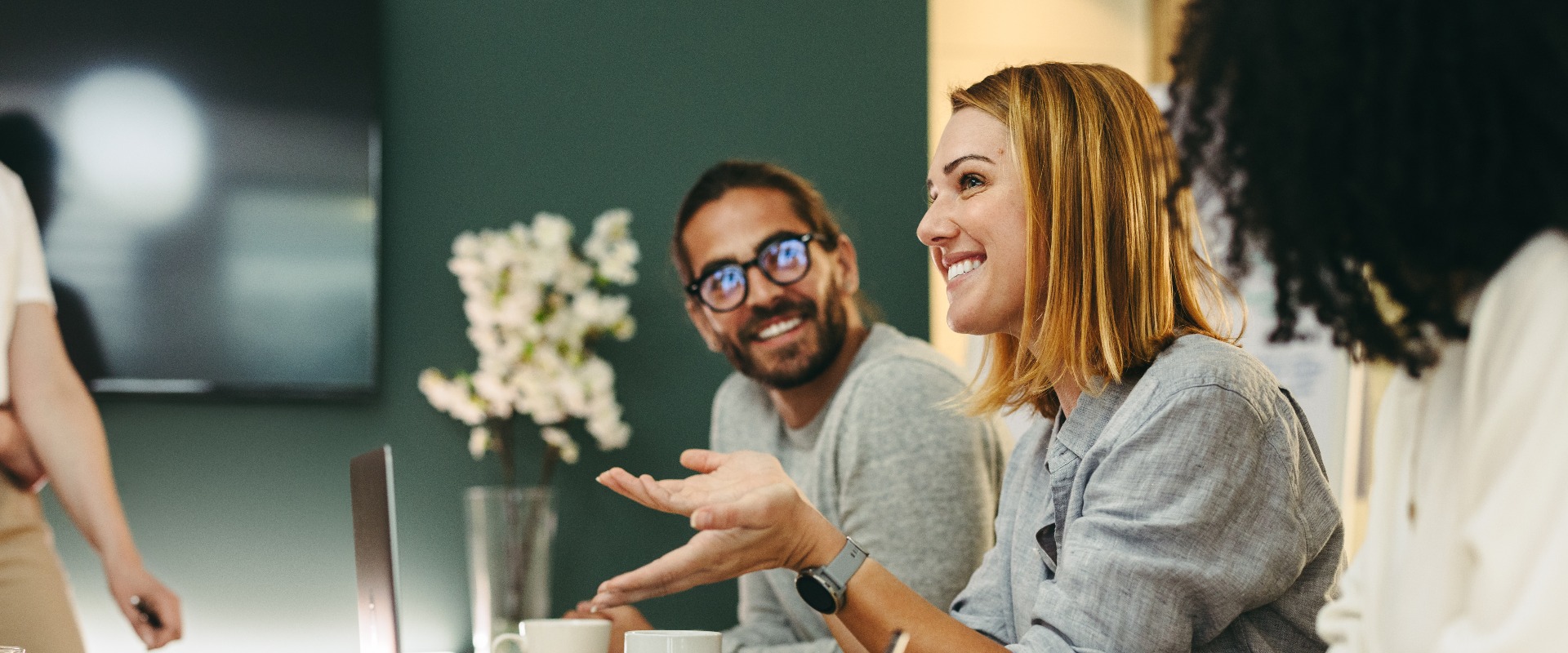 Cheerful businesswoman having a discussion with her colleagues