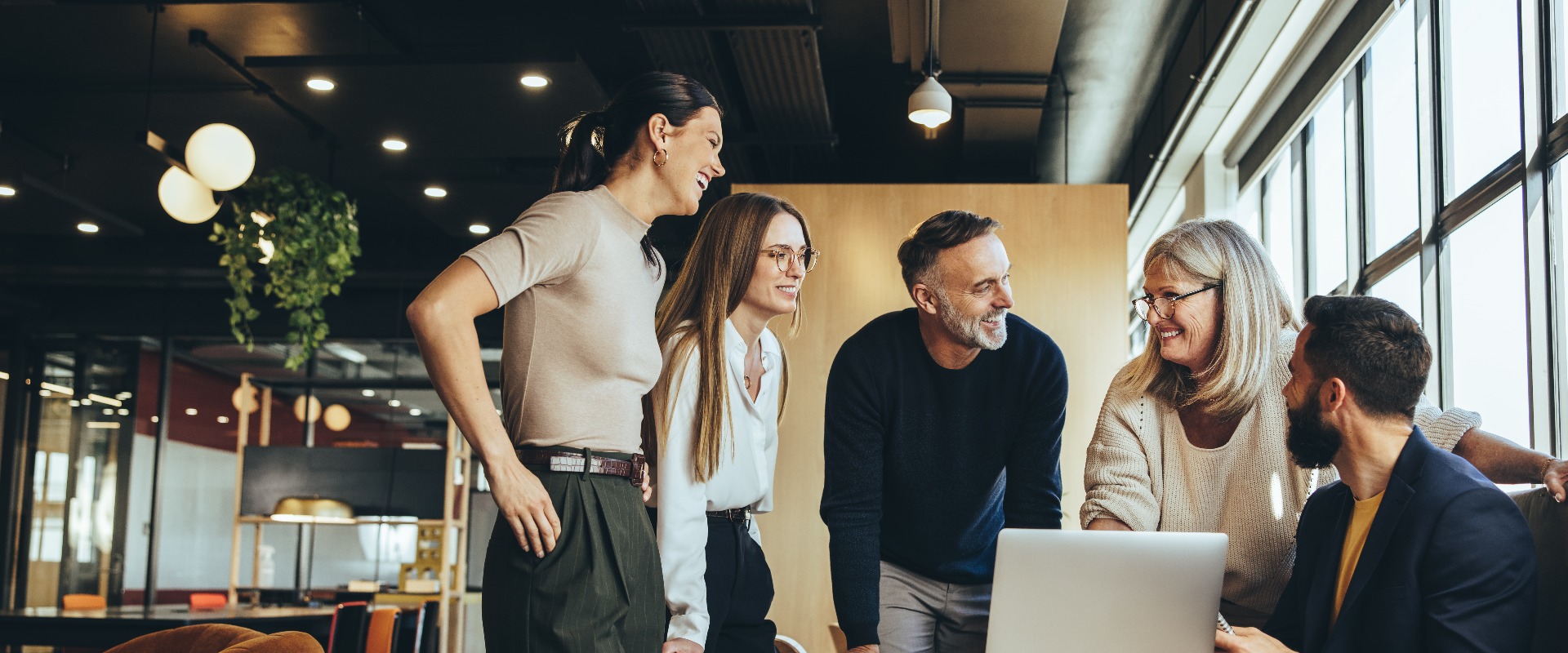 Smiling businesspeople having a discussion in an office